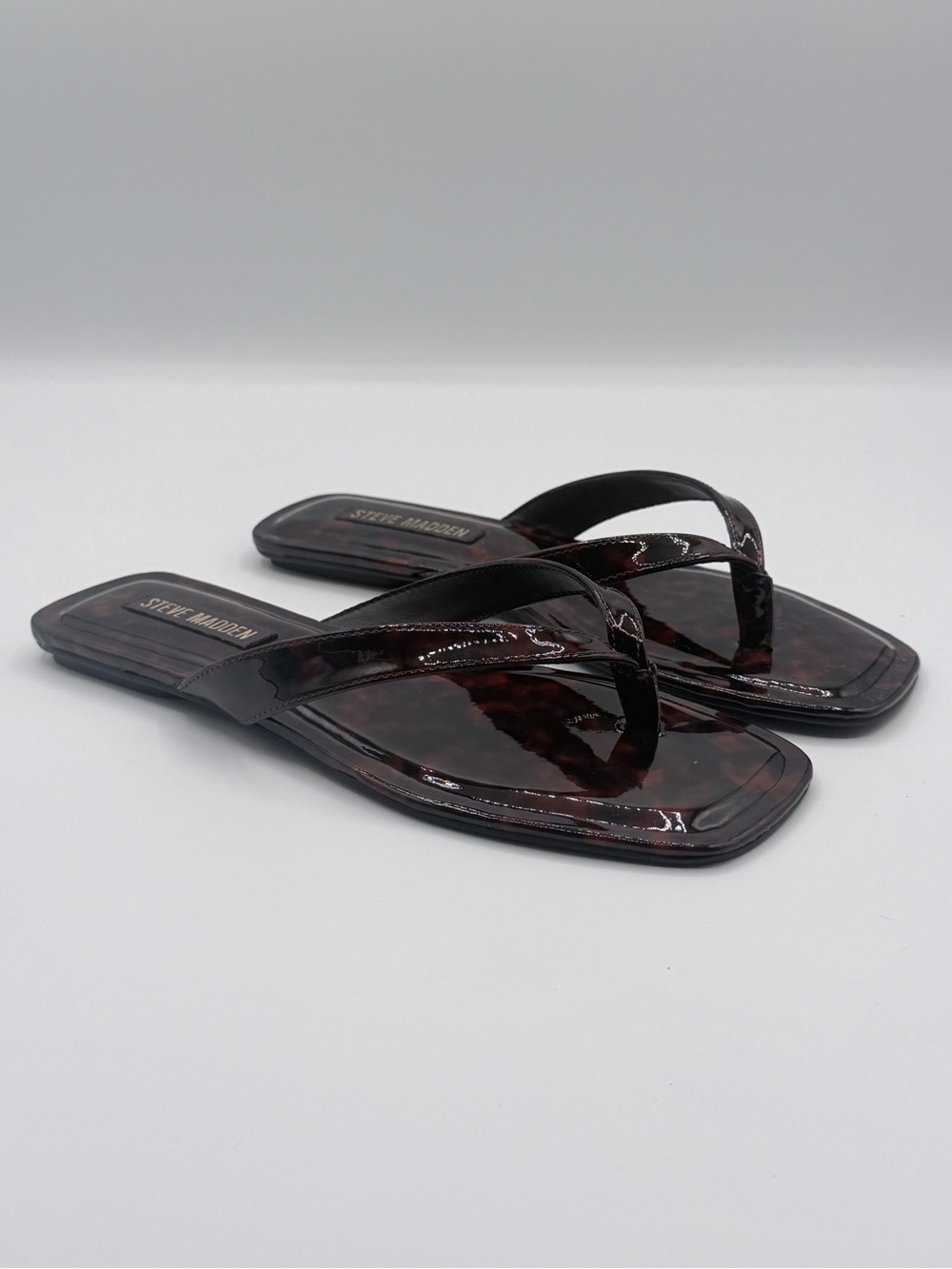 Steve Madden “Trella” Brown Tortoiseshell Patent Flip Flop Sandals